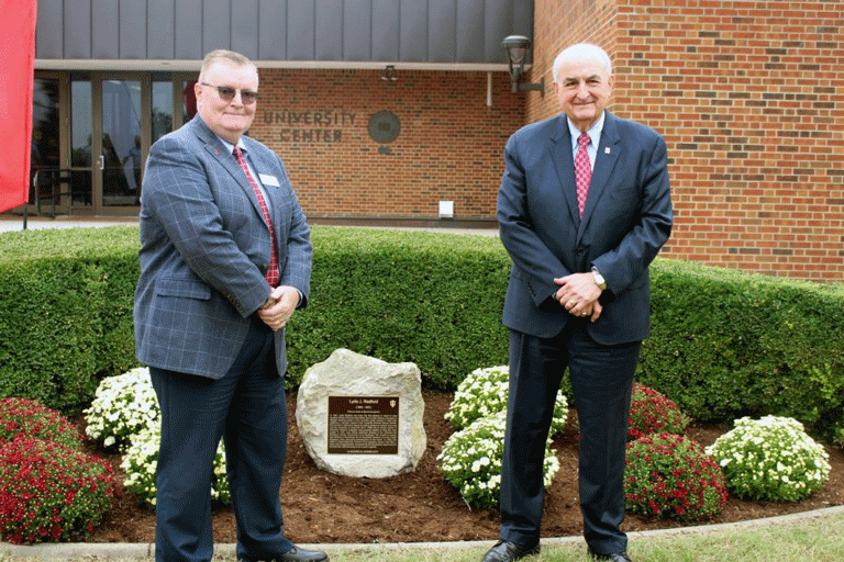Michael McRobbie and Ray Wallace next to Plaque for Lyda Radford